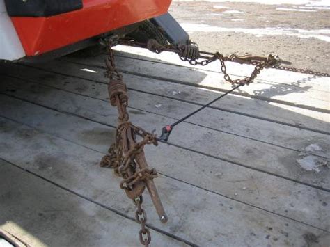 chaining down a skid steer|skid steer bobcat chain.